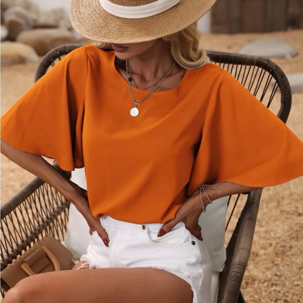 Orange butterfly sleeves dress shirt. Great for a work outfit with black slacks.